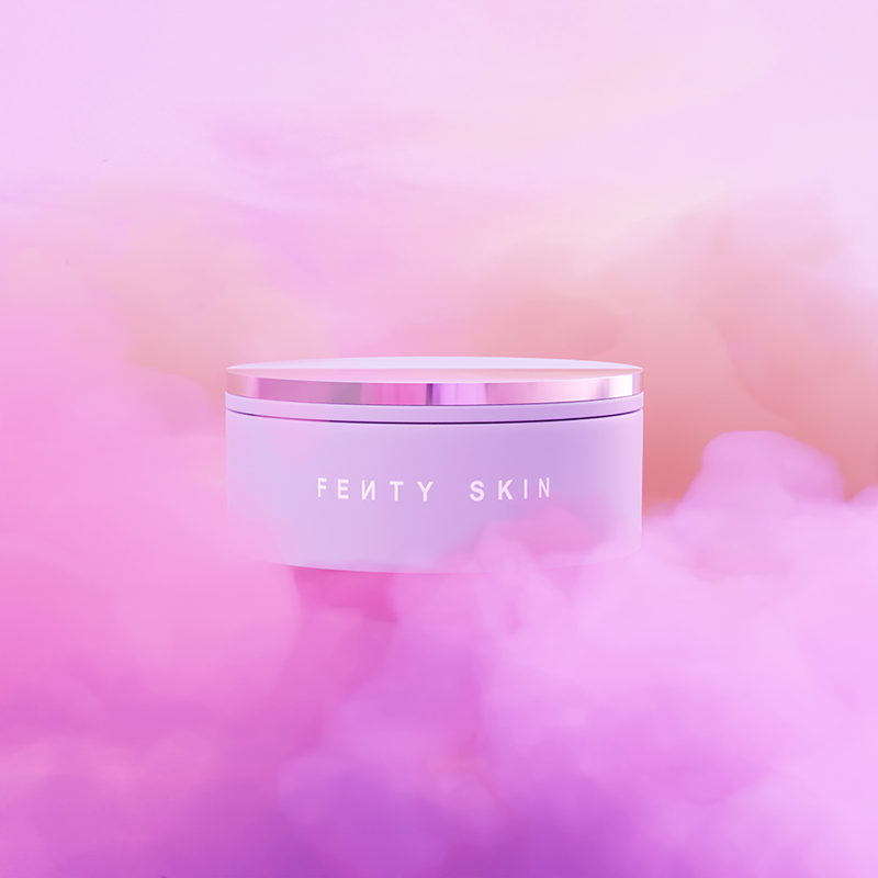 A close-up of a Fenti face cream surroonded by pink and lilac clouds