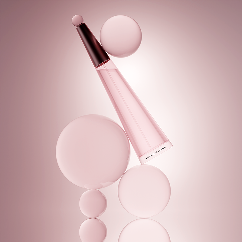 3d product shot of a perfume bottle nestled upon glass spheres