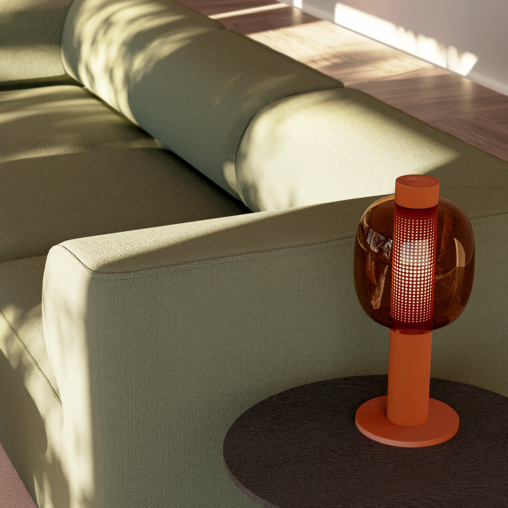 A close-up of a red lamp and a sofa